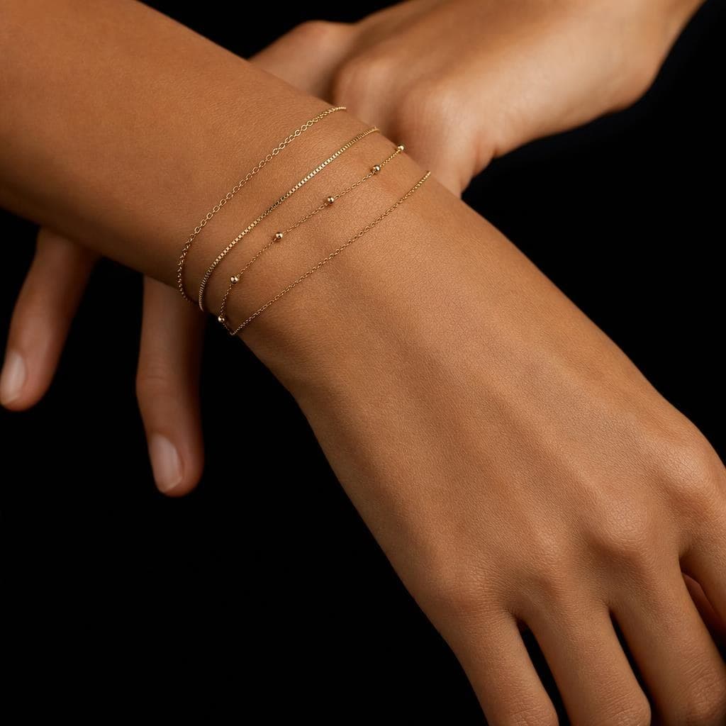Stacked permanent jewelry by Bond & Fifth